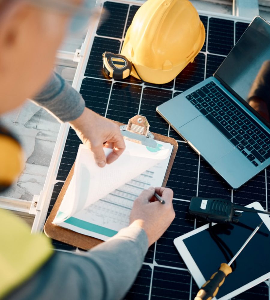 Solar panels, planning and engineering hands with technology, checklist or insurance for installation. Energy saving, electricity and power technician with laptop, tools and maintenance management.